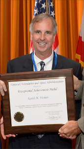 Keith Venter holding the award plaque